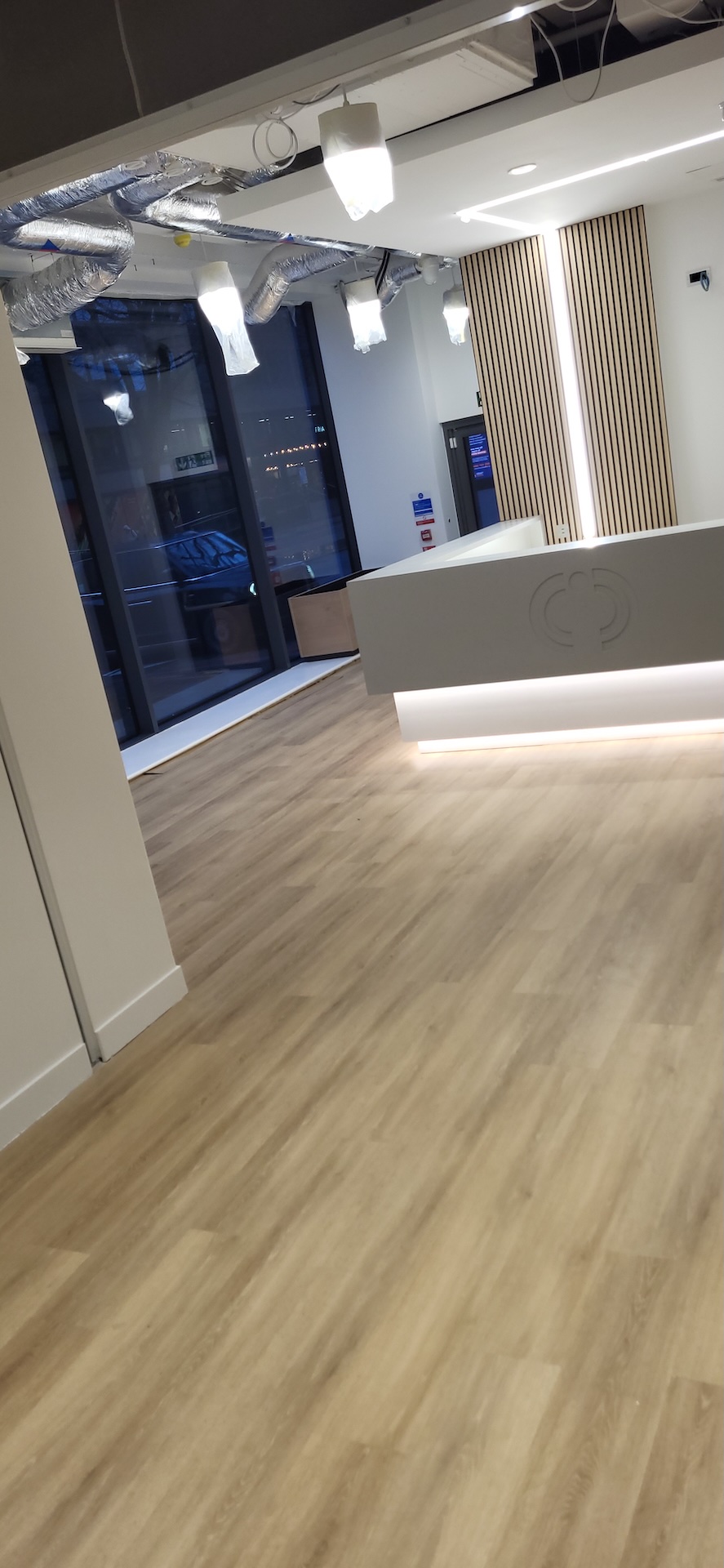 We were invited to work on this project with Main Contractors AIS, near to Blackfriars Bridge. The installation included Paver carpet tiles (with an 84% recycled content), Terazzo vinyl tiles, which have an attractive stone-effect embossing, and Spacia wood-effect LVT.

The areas for LVT installation required careful preparation. Firstly, the existing concrete subfloor was thoroughly cleaned, after which our team applied a specialist smoothing compound to achieve a fine surface for ready for the LVT planks to be installed through the corridor and refreshment points - and to achieve the best transition between the carpet and LVT.

Finally, a new entrance matwell was installed to prevent the ingress of dirt and keep the floors looking pristine.