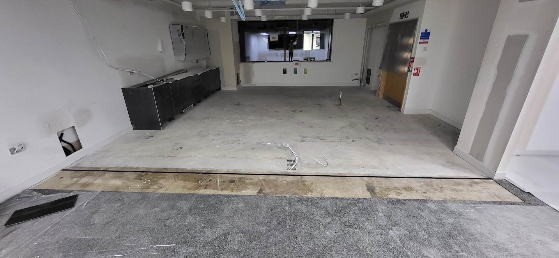 We were invited to work on this project with Main Contractors AIS, near to Blackfriars Bridge. The installation included Paver carpet tiles (with an 84% recycled content), Terazzo vinyl tiles, which have an attractive stone-effect embossing, and Spacia wood-effect LVT.

The areas for LVT installation required careful preparation. Firstly, the existing concrete subfloor was thoroughly cleaned, after which our team applied a specialist smoothing compound to achieve a fine surface for ready for the LVT planks to be installed through the corridor and refreshment points - and to achieve the best transition between the carpet and LVT.

Finally, a new entrance matwell was installed to prevent the ingress of dirt and keep the floors looking pristine.