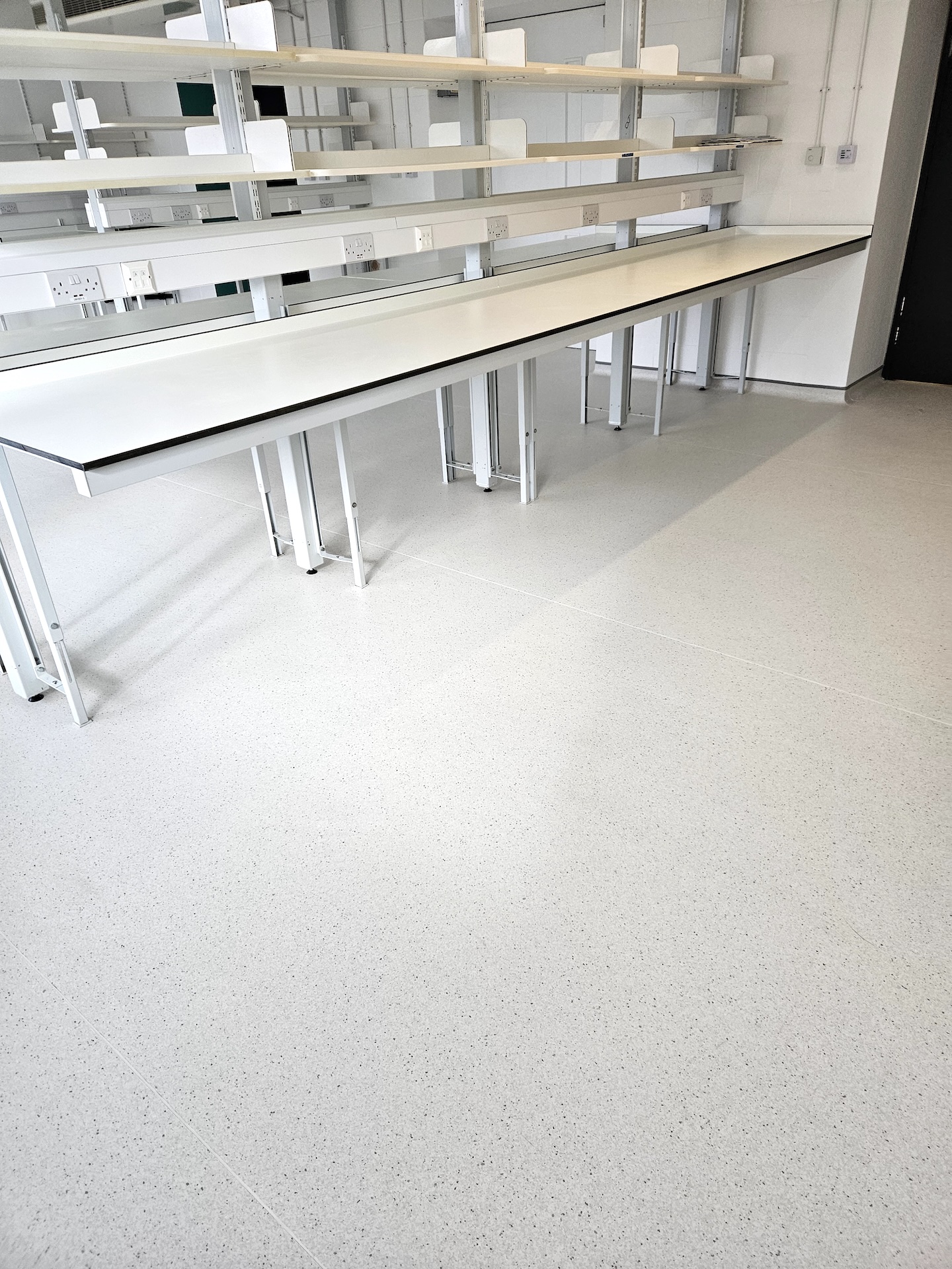 The refurbishment of this large research laboratory building included two different types of safety floor, as well as wood-effect LVT and carpet tiles.

Great care was taken to achieve the clean lines with simple elegance throughout.

The stairs were fitted with wood effect LVT in a brick-bond pattern, each edged with Gradus nosings.
