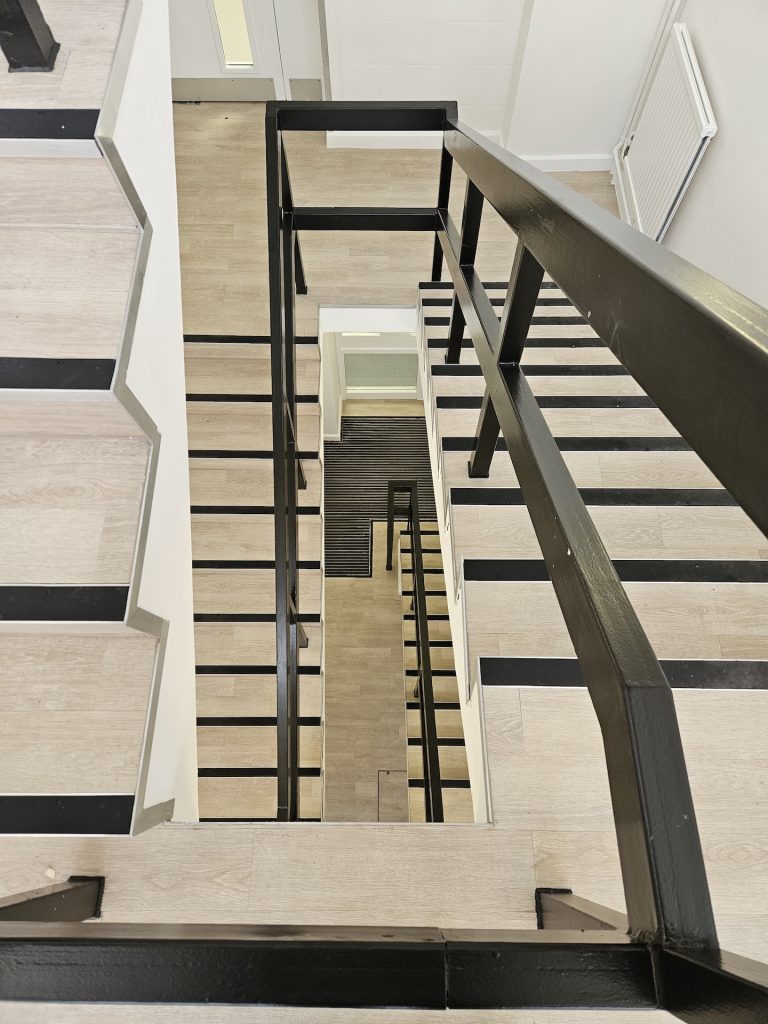 The refurbishment of this large research laboratory building included two different types of safety floor, as well as wood-effect LVT and carpet tiles. Great care was taken to achieve the clean lines with simple elegance throughout. The stairs were fitted with wood effect LVT in a brick-bond pattern, each edged with Gradus nosings.