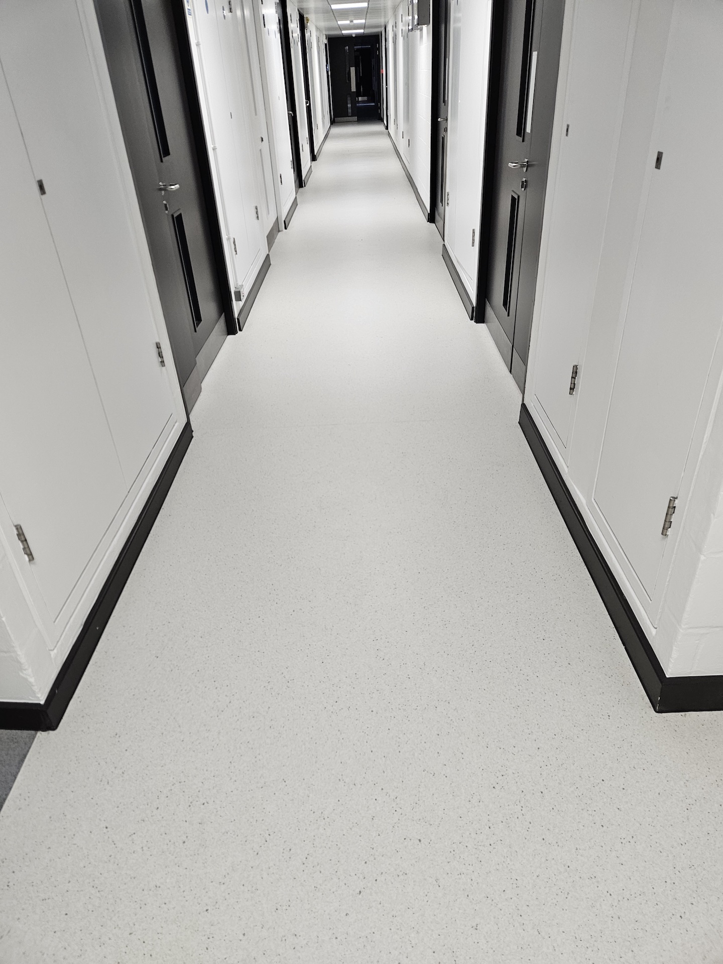 The refurbishment of this large research laboratory building included two different types of safety floor, as well as wood-effect LVT and carpet tiles. Great care was taken to achieve the clean lines with simple elegance throughout. The stairs were fitted with wood effect LVT in a brick-bond pattern, each edged with Gradus nosings.