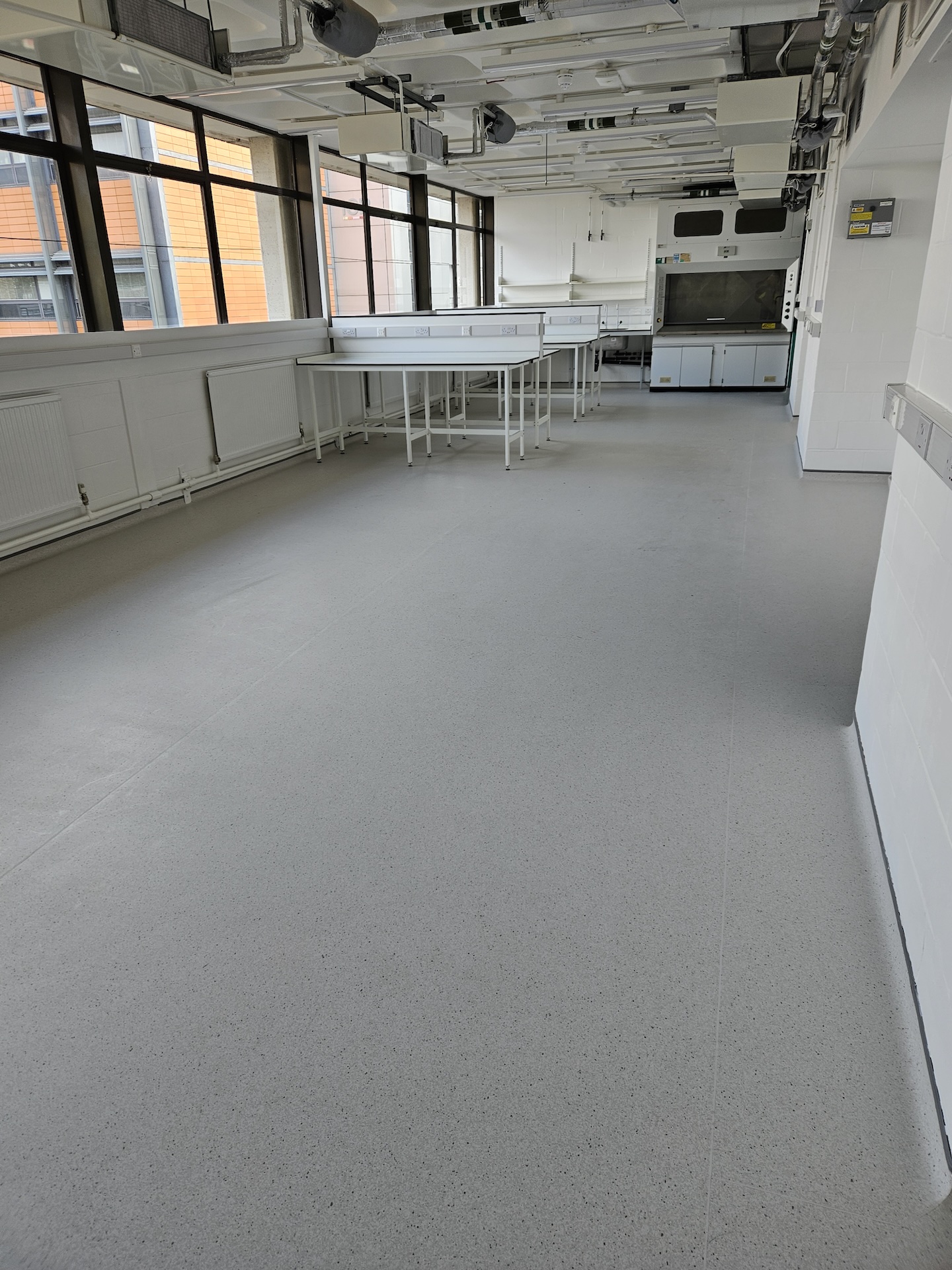 The refurbishment of this large research laboratory building included two different types of safety floor, as well as wood-effect LVT and carpet tiles.

Great care was taken to achieve the clean lines with simple elegance throughout.

The stairs were fitted with wood effect LVT in a brick-bond pattern, each edged with Gradus nosings.
