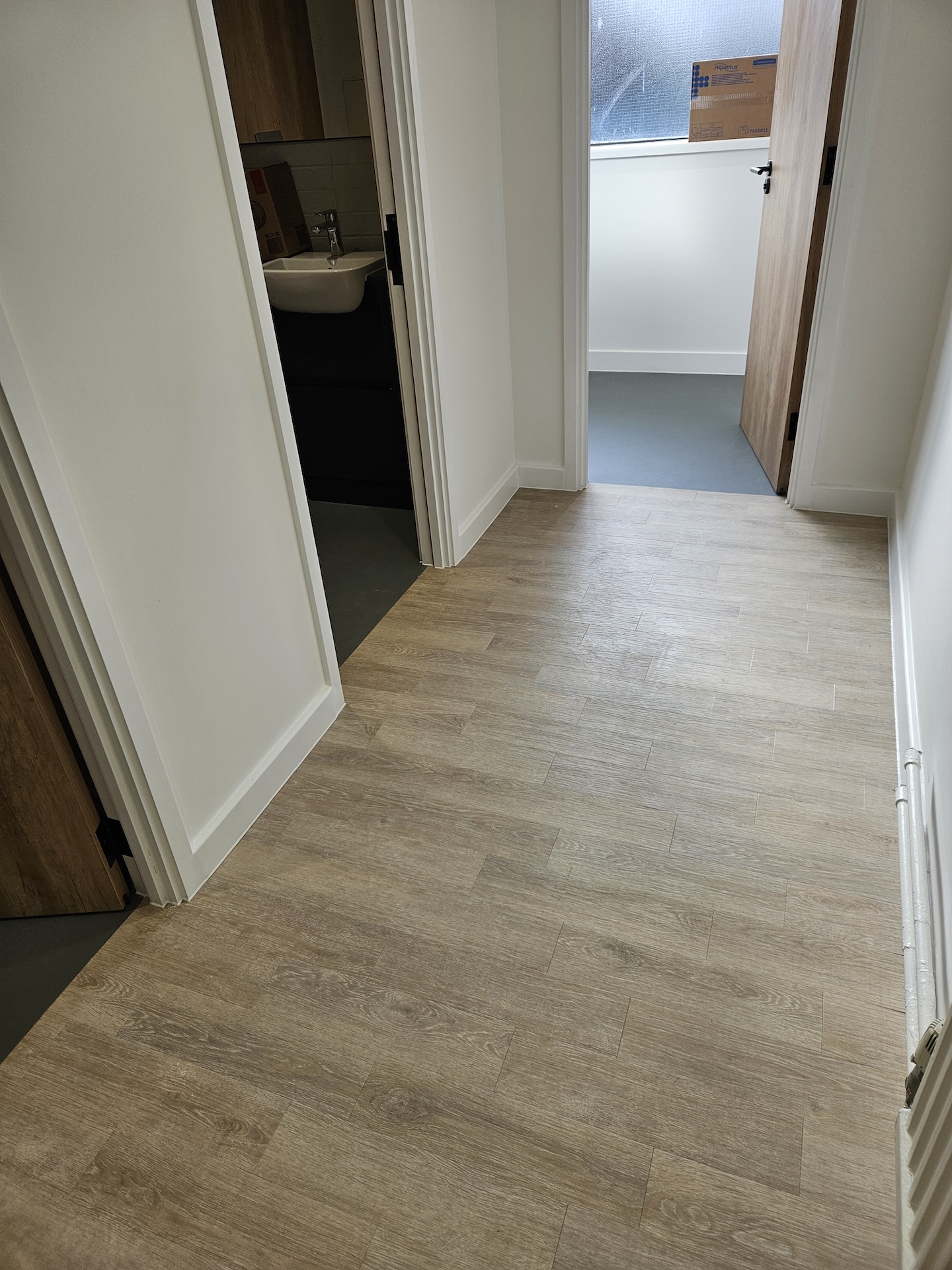 The refurbishment of this large research laboratory building included two different types of safety floor, as well as wood-effect LVT and carpet tiles.

Great care was taken to achieve the clean lines with simple elegance throughout.

The stairs were fitted with wood effect LVT in a brick-bond pattern, each edged with Gradus nosings.
